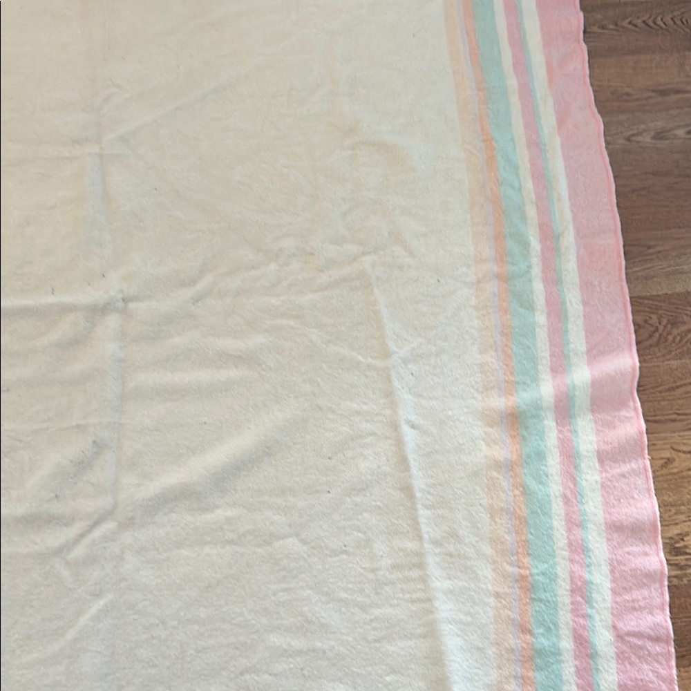 Cozy Pink and White Striped Blanket with Textured Surface